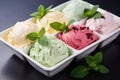 Assorted ice cream flavours with fresh mint on dark background for menu or banner design Royalty Free Stock Photo