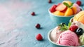 Assorted ice cream scoops in a bowl with fresh fruits and berries on a blue background for a sweet dessert Royalty Free Stock Photo