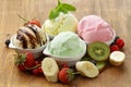 Assorted ice cream (strawberry, banana, mint, chocolate) and fresh berries Royalty Free Stock Photo