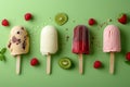 Assorted ice pops with fruits on a green background. Royalty Free Stock Photo