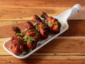 Assorted indian food Chicken makrana kebab on wooden background. Dishes and appetizers of indian cuisine, selective focus Royalty Free Stock Photo