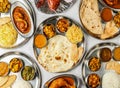 Assorted Indian thali chicken and mutton korma set with biryani, plain rice, pulao, chanay, tandoori chicken, palak, dal, mixed