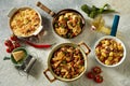 Assorted Italian dishes served on concrete table