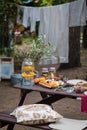 Assorted Italian food table setting in the garden, selective focus