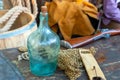 Assorted items sailor bottle on the background net and guns selective focus