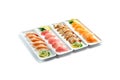 Assorted japanese food dishes on plates on an isolated white background