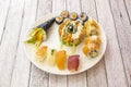 Assorted Japanese sushi with bluefin tuna nigiri, uramaki and avocado surimi, Norwegian salmon tartare and caviar, California roll