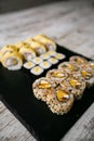 Assorted japanese sushi rolls on black background. Royalty Free Stock Photo