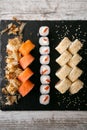 Assorted japanese sushi rolls on black background Royalty Free Stock Photo