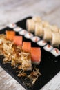 Assorted japanese sushi rolls on black background Royalty Free Stock Photo