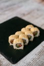 Assorted japanese sushi rolls on black background Royalty Free Stock Photo
