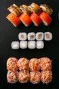 Assorted japanese sushi rolls on black background Royalty Free Stock Photo