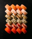 Assorted japanese sushi rolls on black background Royalty Free Stock Photo