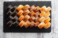 Assorted japanese sushi rolls on black background. Royalty Free Stock Photo