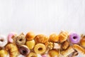 Assorted junk food multiple type on white wooden table of top view with copy space Royalty Free Stock Photo