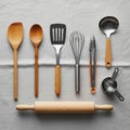 Assorted kitchen utensils are neatly displayed on a light-colored cloth Royalty Free Stock Photo