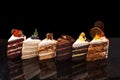 Assorted large pieces of different cakes: chocolate, raspberries, strawberries, nuts, blueberries. Pieces of cakes on a