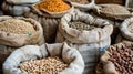 Assorted legumes in burlap sacks at a market. Close-up food photography