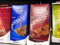 Assorted lindt chocolate bars on display in supermarket aisle Royalty Free Stock Photo