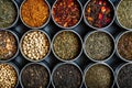 Assorted loose tea leaves in round metal tins. Variety and tea tasting concept