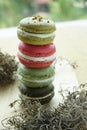 Assorted macaroon on display with pistachio, raspbery and greentea cream