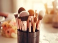 Assorted makeup brushes with copy space, beauty artist workspace, bunch of different brushes on blurred background