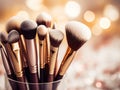 Assorted makeup brushes with copy space, beauty artist workspace, bunch of different brushes on blurred background