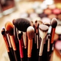 Assorted makeup brushes with copy space, beauty artist workspace, bunch of different brushes on blurred background