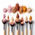 Assorted makeup brushes with various eyeshadow pigments in a creative display Royalty Free Stock Photo