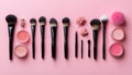 Assorted makeup brushes and vibrant blushes on pink background Royalty Free Stock Photo