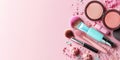 Assorted makeup on pink background: brushes, lipstick, and blush Royalty Free Stock Photo