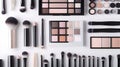 Assorted makeup products with brushes and palette for beauty and cosmetics on white background Royalty Free Stock Photo