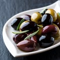 Assorted marinated olives on a plate