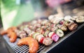 Assorted meat from chicken, pork and various vegetables on barbecue grill Royalty Free Stock Photo