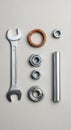 Assorted metal tools and components on a textured surface. Includes an open-end Royalty Free Stock Photo