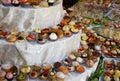 Assorted mignon pastries with creams and fruit on a buffet table Royalty Free Stock Photo