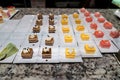 Assorted mini desserts lined up in neat rows