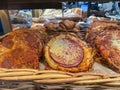 Assorted mini pizza displayed in bakery basket Royalty Free Stock Photo