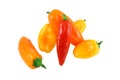 Assorted Miniature Sweet Peppers On A White Backgr