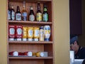 An assorted mix of burger and hot dog condiments on the wall, ketchup mustard