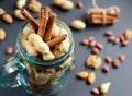 Assorted mixed nuts in a glass jar, peanuts, almonds, walnuts and sesame seeds Royalty Free Stock Photo