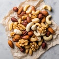 Assorted mixed nuts on parchment paper closeup Royalty Free Stock Photo