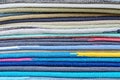 Assorted multicolored soft mats lying in one pile in modern shop