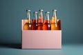 Assorted nonalcoholic drink bottles and a white paper box against a Toscha backdrop,