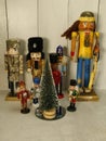 Assorted Nutcrackers, around frosted Christmas tree