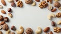 Assorted nuts background with copy space, top view on white, realistic stock photo
