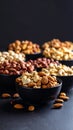 Assorted nuts in black bowls on dark background healthy food concept Royalty Free Stock Photo