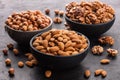 Assorted nuts. Close-up, peeled walnuts, almonds and hazelnuts in bowls