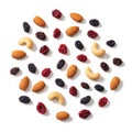Assorted nuts and dried fruits arranged in a circular pattern on a white background Royalty Free Stock Photo
