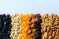 Assorted nuts and dried fruits on white surface Royalty Free Stock Photo